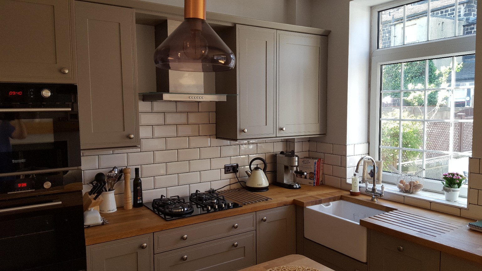 Shaker doors, metro tiling and a Belfast-style sink. Fitted by RCB.