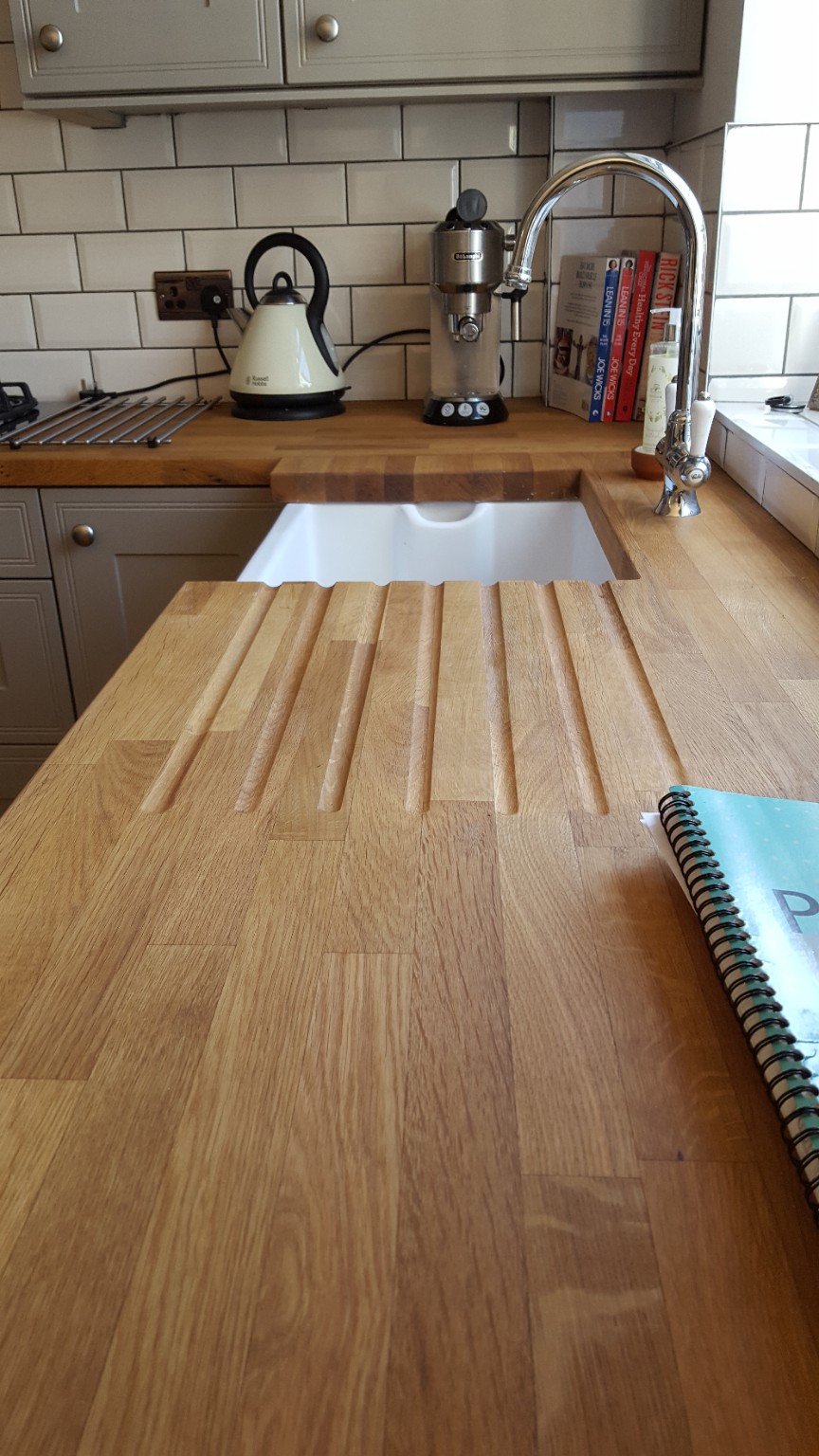 A fitted sink and drainer grooves worked into the timber surface. Fitted by RCB.